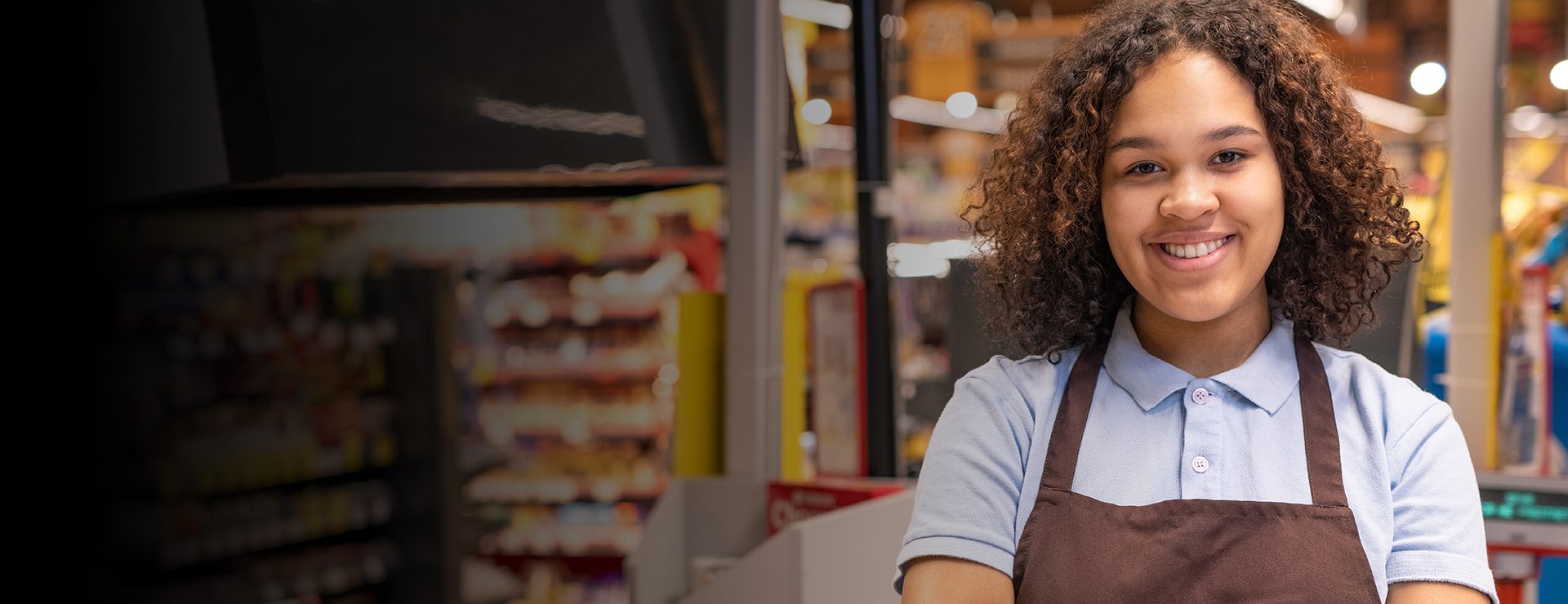 Woman in apron smiles